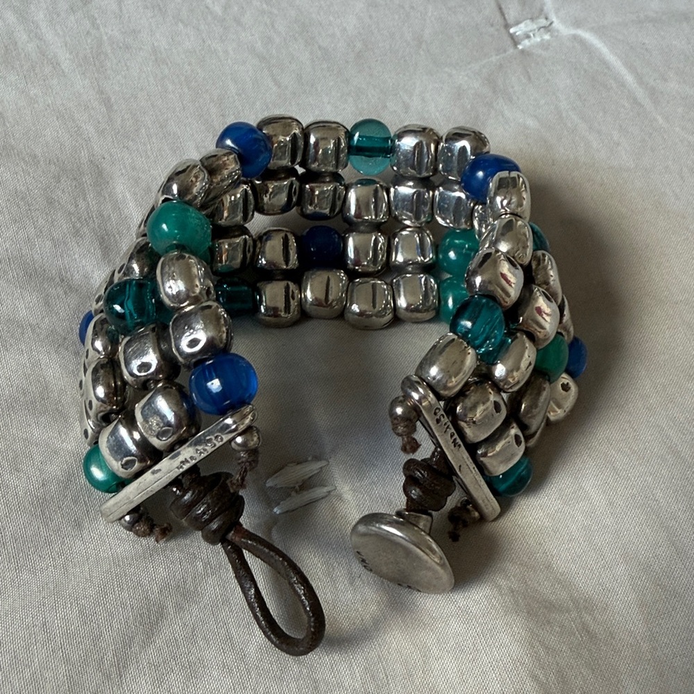 UNO de 50 Silver Beaded Bracelet with Blue and Green Accents and leather.